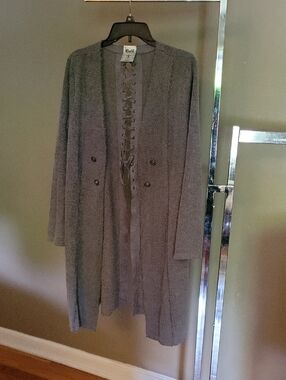 Vocal gray knit top with a lace-up back detaill